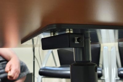 Covert black-box audio recorder placed under table